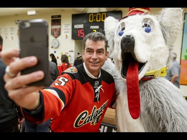 Calgary Flames announcer Beesley shoots a selfie with team mascot Harvey the Hound after an annual wheelchair floor hockey game between the Townsend Tigers and the Flames at the Alberta Children's Hospital in Calgary, Alta., on Tuesday, Jan. 31, 2017. The Townsend Tigers, made up of kids who attend Dr. Gordon Townsend School at the hospital, beat the Flames for the 36th year in a row, this year by a 15-0 score. Lyle Aspinall/Postmedia Network