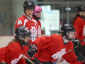 FILE PHOTO: Former Team Canada hockey player Cassie Campbell-Pascall (l) watches players run-through a drill during the Girls Hockey Fest in Winnipeg, Man. Sunday December 11, 2016. Brian Donogh/Winnipeg Sun/Postmedia Network