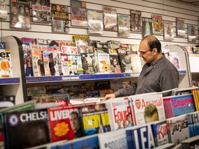 Shop owner Navaz Asaria selects the magazines carefully for  his newsstand, the Daily Globe.