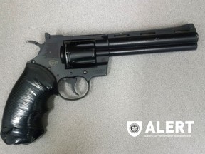 Handgun seized in raid on suspected drug den in Medicine Hat.