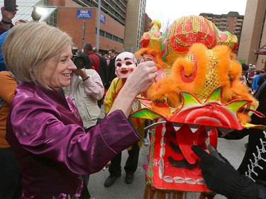 Alberta Premier Rachel Notley participates in the traditional eye-dotting ceremony during Chinese Lunar New Year celebrations in downtown Calgary, Alta at the Chinese Cultural Centre on Saturday January 28, 2017. Jim Wells/Postmedia