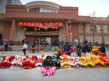 A performer takes a break before participating in the lion and dragon dance during Chinese Lunar New Year celebrations in downtown Calgary, Alta at the Chinese Cultural Centre on Saturday January 28, 2017. Jim Wells/Postmedia
