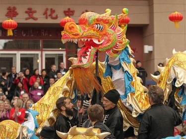 The dragon and lion dance fulls the street during Chinese Lunar New Year celebrations in downtown Calgary, Alta at the Chinese Cultural Centre on Saturday January 28, 2017. Jim Wells/Postmedia