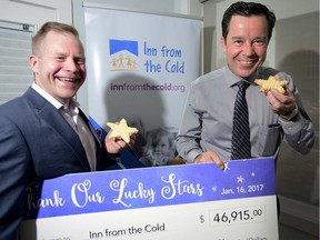 Inn from the Cold Exective director Abe Brown and Sunterra Market president Glen Price share in some cookies on January 16 after Sunterra Market raised $46,915 through a month-long cookie selling campaign #LuckStarsCookie which ran in all Sunterra locations in Calgary. The campaign supports homeless children and their families. Inn from the Cold works as an agency to provide assistance for families and children in need of short term or long term help. RYAN MCLEOD FOR POSTMEDIA CALGARY