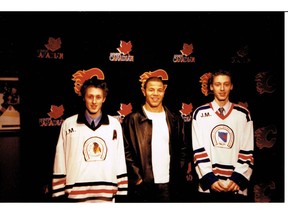 Jarome Iginla poses with twin brother Curtis Johnson (left) and current Calgary Flames goalie Chad Johnson, back in their bantam triple-A days in southeast Calgary. Chad would go on to play with Iginla in Boston. (Courtesy Terry and Karen Johnson)