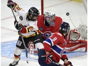 Calgary Inferno's Jessica Campbell (20) watches her shot go in the net past Les Canadiennes de Montreal goalie Charline Labonte (32) during the third period of Canadian Women's Hockey League final action at the Clarkson Cup last season. The Inferno are in Japan on a team-building trip.