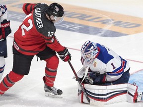 Canada's Julien Gauthier  looks for a rebound in front of Team USA's goaltender Tyler Parsons  during second period IIHF World Junior Championships gold medal hockey action Thursday, January 5, 2017 in Montreal.