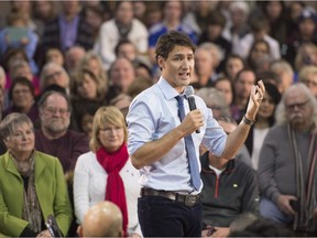 Prime Minister Justin Trudeau speaks during a town hall meeting in Peterborough, Ont., where he suggested Canada needs to phase out the oilsands.