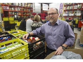 Calgary Food Bank CEO James McAra poses alongside one of the sorting lines Wednesday November 4, 2015.