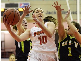 University of Calgary Dinos guard Brianna Ghali fights off defenders on the way to a 69-59 win over the University of Fraser Valley Cascades on Thursday, Jan. 12. (Ryan McLeod)