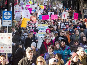 A throng walks down Stephen Avenue during the Calgary Women's March in downtown Calgary, Alta., on Saturday, Jan. 21, 2017. About 4,000 people joined in support of the Women's March on Washington, one of 10 such shows of solidarity across Canada a day after President Donald Trump's inauguration. Lyle Aspinall/Postmedia Network