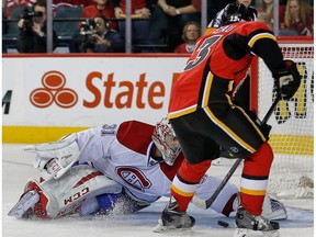 Montreal Canadiens goalie Carey Price makes a save on Johnny Gaudreau of the Calgary Flames in Calgary on Oct. 28, 2014. (Al Charest)