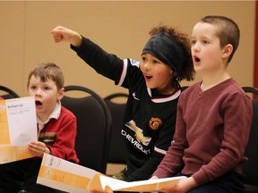 Junior boys in the Calgary Boys Choir warm up their voices before rehearsal and auditions at Mount Royal University's Bella Hall on Jan. 10, 2017.