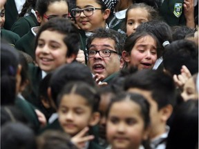 Calgary Mayor Naheed Nenshi is surrounded by excited students of Chris Akkerman School after announcing the results of the 2016 Mayor's Christmas Food Drive on Tuesday January 31, 2017. The drive raised $685,041 in food and funds. The students of Chris Akkerman won the people's choice award for the CANstruction Jr. contest. GAVIN YOUNG/POSTMEDIA