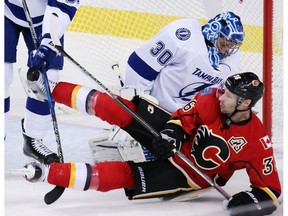 Calgary Flames forward Troy Brouwer collides with Tampa Bay Lightning goaltender Ben Bishop at the Scotiabank Saddledome on Dec. 14, 2016. (Gavin Young)