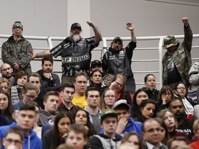 Protesters shout as Prime Minister Justin Trudeau speaks at a town hall meeting at the University of Winnipeg last Thursday.