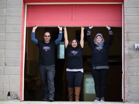 Sam Nammoura, left, Saima Jamal and Kimberley Tubrett, right, open the new Syrian warehouse in Calgary, Alta., on Wednesday, January 18, 2017. Leah Hennel/Postmedia