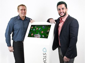 Storm Division co-founders Simon House and Nathan Mackenzie, with one of their Storm Kiosks.
