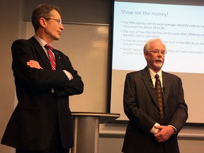 Liberal Leader David Swann and former utilities consumer advocate Rob Spraggins speak at a news conference in Calgary Wednesday.