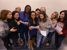 The cast gathers for a group photo during rehearsals of the Shoe Project, which is a theatrical production featuring immigrant women of Calgary.