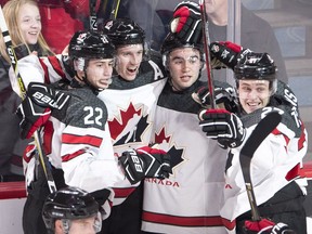 Canada defenceman Thomas Chabot (5) celebrates his goal against Czech Republic with teammates Anthony Cirelli (22), Dillon Dube (9) and Mitchell Stephens (27) during the quarter-final of the IIHF World Junior Championships on Monday, Jan. 2, 2017 in Montreal. (The Canadian Press)