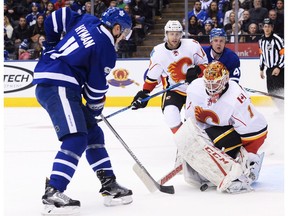 Toronto Maple Leafs centre Zach Hyman scores on Calgary Flames goalie Brian Elliott in Toronto on Monday, Jan. 23, 2017. (Nathan Denette/The Canadian Press)