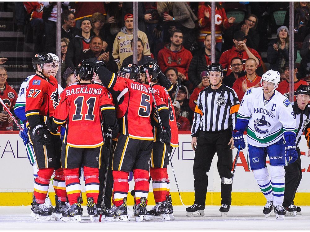 Flames, Canucks play out season amid playoff backdrop