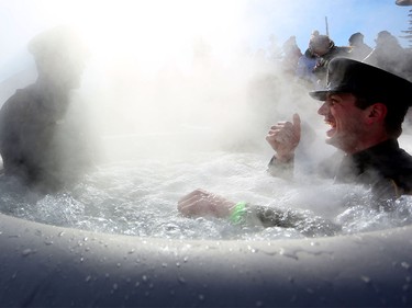 Members of Fish and Wildlife warm up in the hot tub after taking an icy dip during the Polar Plunge Calgary on Saturday February 25, 2017, in support of Special Olympics. Leah Hennel/Postmedia