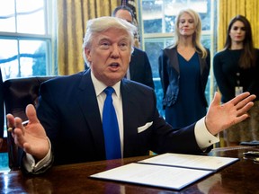 US President Donald Trump signs an executive order Jan. 24, 2017 reviving construction of the Keystone XL pipeline on Jan. 24, 2017.