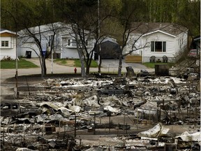 Thousands of homes in the city of Fort McMurray, Alberta were devastated by a massive wildfire in May, 2016 that forced the evacuation of approximately 90,000 residents. A state of emergency was declared in the province of Alberta as residents fled for their lives. What started as a small fire burning in the woods outside Alberta's fourth largest city became Canadas most expensive disaster, estimated at over $3.5 billion. The haunting images of the mass destruction caused by the wildfire forever changed the lives of the city's residents and brought a country together in the aftermath.

http://edmontonjournal.com/year-in-review/year-in-review-larry-wongs-top-photos-and-video-of-2016