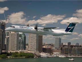 WestJet's Encore inaugurated its service with two Bombardier Inc. de Havilland Dash-8 Q400s in 78-seat configurations, growing to seven aircraft by the end of the year. Plane is seen with Toronto skyline in the background. (Photo courtesy of Westjet)