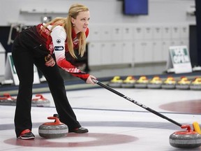 Team Canada skip Chelsea Carey lines up a rock for her teammates as they train in Calgary, Alta., Monday, Feb. 13, 2017. Carey returns to the Canadian women&#039;s curling championship feeling tighter with her team and oddly rested.THE CANADIAN PRESS/Jeff McIntosh