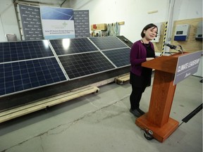 Former Environment Minister Shannon Phillips announces an Energy Efficiency Alberta program for solar panel installation rebates in 2017.