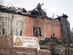 Char and ashes mark the east entrance to Symons Valley Ranch Market in Calgary on Feb. 18, 2017. Fire destroyed most of the market about three weeks earlier.