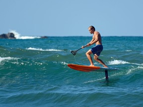 A foilboard has a hydrofoil that extends below the board into the water. This design causes the board to leave the surface of the water as it picks up speed. We saw a surfer using a hydrofoil paddleboard at the main beach in Sayulita, Riviera Nayarit's surf town.