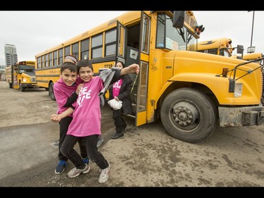 Kids excitedly get off a bus for the first-ever BE BRAVE Anti-Bullying Game, a regular-season WHL tilt between the Calgary Hitmen and Brandon Wheat Kings, in Calgary, Alta., on Wednesday, Feb. 22, 2017. More than 8,000 students from Calgary and area were bussed to the morning game as part of Pink Shirt Day, enjoying concourse activities and special entertainment in addition to the regular-season game. Lyle Aspinall/Postmedia Network