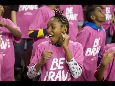 Students dance during the first-ever BE BRAVE Anti-Bullying Game, a regular-season WHL tilt between the Calgary Hitmen and Brandon Wheat Kings, in Calgary, Alta., on Wednesday, Feb. 22, 2017. More than 8,000 students from Calgary and area were bussed to the morning game as part of Pink Shirt Day, enjoying concourse activities and special entertainment in addition to the regular-season game. Lyle Aspinall/Postmedia Network