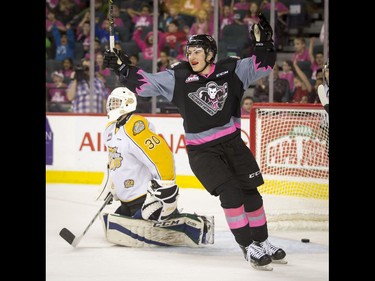 Matteo Gennaro of the Calgary Hitmen celebrates his team's second goal on Brandon Wheat Kings goalie Travis Child during the first-ever BE BRAVE Anti-Bullying Game, a regular-season WHL tilt between the Calgary Hitmen and Brandon Wheat Kings, in Calgary, Alta., on Wednesday, Feb. 22, 2017. More than 8,000 students from Calgary and area were bussed to the morning game as part of Pink Shirt Day, enjoying concourse activities and special entertainment in addition to the regular-season game. Lyle Aspinall/Postmedia Network