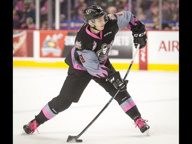 Vladislav Yeryomenko of the Calgary Hitmen shoots during the first-ever BE BRAVE Anti-Bullying Game, a regular-season WHL tilt between the Calgary Hitmen and Brandon Wheat Kings, in Calgary, Alta., on Wednesday, Feb. 22, 2017. More than 8,000 students from Calgary and area were bussed to the morning game as part of Pink Shirt Day, enjoying concourse activities and special entertainment in addition to the regular-season game. Lyle Aspinall/Postmedia Network