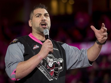 Randy Chevrier of the Calgary Stampeders speaks during the first intermission of the first-ever BE BRAVE Anti-Bullying Game, a regular-season WHL tilt between the Calgary Hitmen and Brandon Wheat Kings, in Calgary, Alta., on Wednesday, Feb. 22, 2017. More than 8,000 students from Calgary and area were bussed to the morning game as part of Pink Shirt Day, enjoying concourse activities and special entertainment in addition to the regular-season game. Lyle Aspinall/Postmedia Network