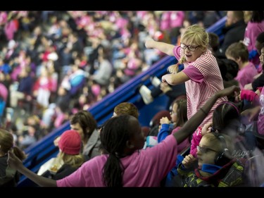 Kids dance during the first-ever BE BRAVE Anti-Bullying Game, a regular-season WHL tilt between the Calgary Hitmen and Brandon Wheat Kings, in Calgary, Alta., on Wednesday, Feb. 22, 2017. More than 8,000 students from Calgary and area were bussed to the morning game as part of Pink Shirt Day, enjoying concourse activities and special entertainment in addition to the regular-season game. Lyle Aspinall/Postmedia Network