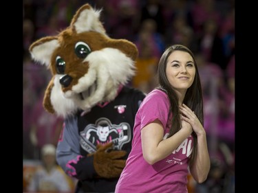 Kelcey Moore is backed by mascot Farley the Fox while leading the Be Brave dancers in a quick routine during the first-ever BE BRAVE Anti-Bullying Game, a regular-season WHL tilt between the Calgary Hitmen and Brandon Wheat Kings, in Calgary, Alta., on Wednesday, Feb. 22, 2017. More than 8,000 students from Calgary and area were bussed to the morning game as part of Pink Shirt Day, enjoying concourse activities and special entertainment in addition to the regular-season game. Lyle Aspinall/Postmedia Network