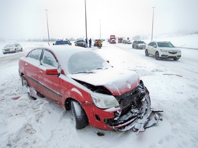 Emergency workers deal with a multi-car collision on Deerfoot Trail at Southland Drive on Feb. 5, 2017.