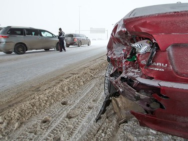 Emergency workers deal with a multi-car collision on Deerfoot Trail at Southland Drive on Sunday February 5, 2017. At least 10 cars were involved in several different accidents at the same location.