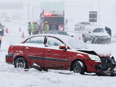 Emergency workers deal with a multi-car collision on Deerfoot Trail at Southland Drive on Sunday February 5, 2017. At least 10 cars were involved in several different accidents at the same location.