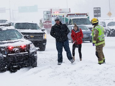 Emergency workers deal with a multi-car collision on Deerfoot Trail at Southland Drive on Sunday February 5, 2017. At least 10 cars were involved in several different accidents at the same location.