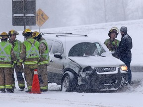 Emergency workers deal with a multi-car collision on Deerfoot Trail at Southland Drive on Sunday February 5, 2017. At least 10 cars were involved in several different accidents at the same location.