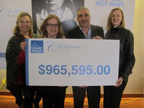 FILE PHOTO: Since 1991, the Calgary Herald Christmas Fund has raised more than $25 million for myriad charitable organizations-$965,595 this past year alone. Pictured with reason to smile at the cheque presentation ceremony for the 2016 Herald Christmas Fund are, from left, Fund administrator Laura Linnell, Herald deputy editor Monica Zurowski, Herald editor Jose Rodriguez and  Christmas Fund editor Valerie Berenyi.