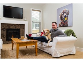Jeff Langdon and his dog Cheyenne in their new home in EvansRidge.