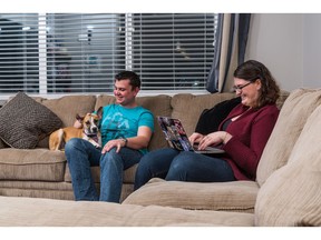 Ginny Brooks-Aubin and Robert Hudson with their dog Piper in their new townhome at Arrive at SkyView Ranch Arbours by Partners Development Group.